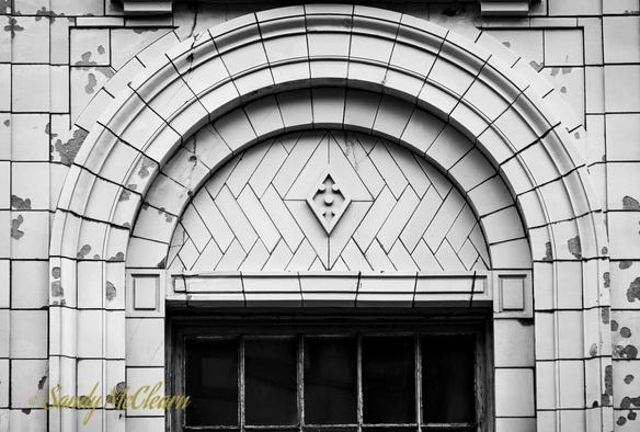Stonework archway over a doorway.