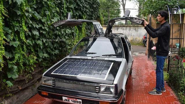 India's Tesla? The math teacher who built a solar car from scratch - This Indian man just made a luxurious dream come true! Math teacher Bilal Ahmed from Srinagar has done the impossible, creating a solar-powered car over 11 years - no more waiting for Tesla to arrive in India! Food prices may be soaring but for those who want to drive around in luxury, this car is out there.

Bilal Ahmed set out to create a car that was both luxurious and sustainable. His car operates on solar power and is equipped with solar panels. It's a much more affordable alternative to the luxury cars from the likes of Mercedes, Ferrari, and BMW that so many people can only dream of owning.