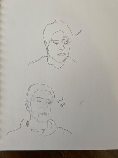 Realistic pencil line sketches of two different people’s heads on a white sketch pad.