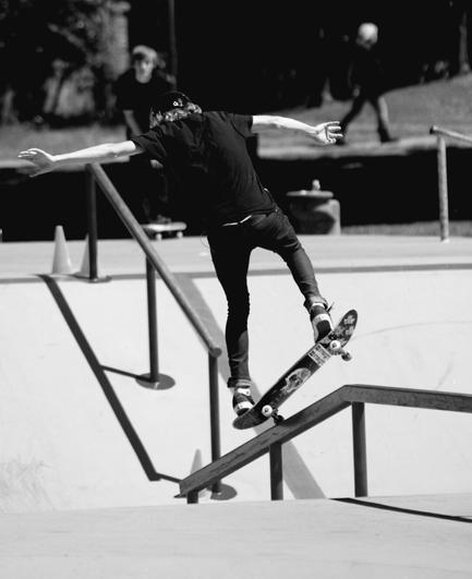 Skateboarding riding the steel rail