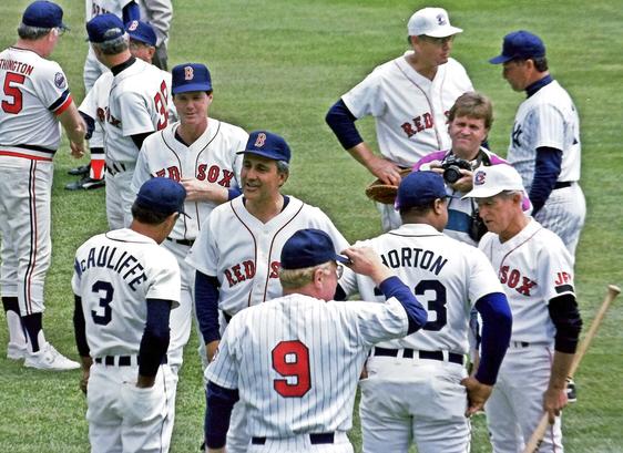 Former Tiger Dick McAuliffe talks with for Red Sox players Mike Andrews and Rico Petrocelli as former Twin Rich Rollins looks on. Former Tiger Willie Horton speaks with Red Sox legend Johnny Pesky.