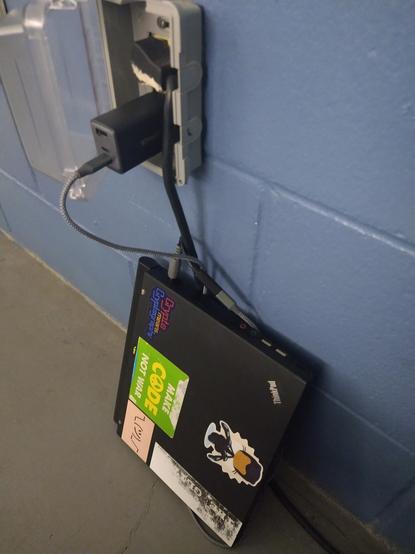 Janky, beautiful Thinkpad x61/x62 leaning against the wall, juicing up with a USB-C power plug and this barrel-to-USBC adapter