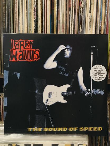 Larry Wallis in red text
The Sound of Speed in yellow text at the bottom. Larry standing with his guitar looking a bit dazed but undoubtedly laying down a face melter of a solo