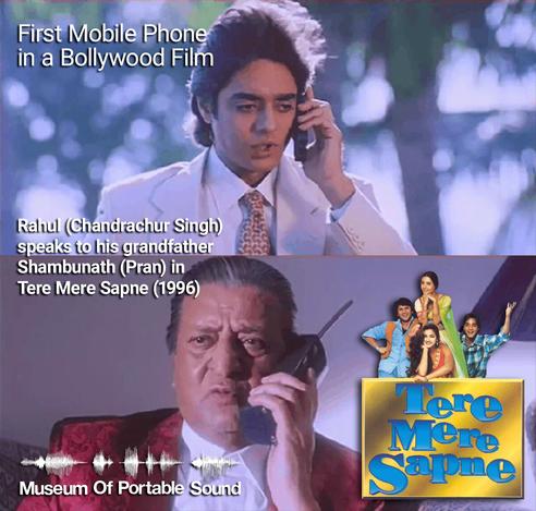 Two screenshots from the film Tere Mere Sapne (1996). At the top, a young Desi man in a pearl/pink suit holds a mobile phone up to his left ear while standing outdoors. At the bottom, an older Desi man in a burgundy velvet jacket and white shirt holds a wireless telephone up to his left ear while sitting indoors.