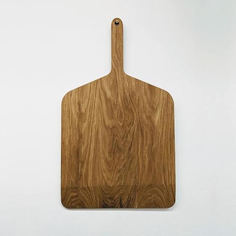 A white oak pizza paddle.