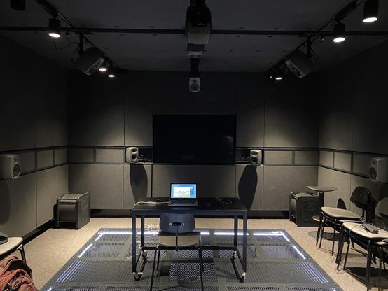 What looks like a prison cell is actually the sound lab at ARUP. 16 speakers and a lot of darkness.