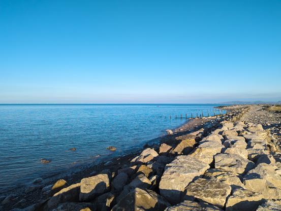 A late afternoon, sunny view out to sea from Llanddulas Beach.