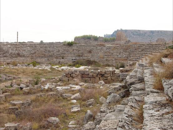 A view of the stadium seating and turn of the stadium in Perge. Tumbledown stones suggest its age but it is largely intact