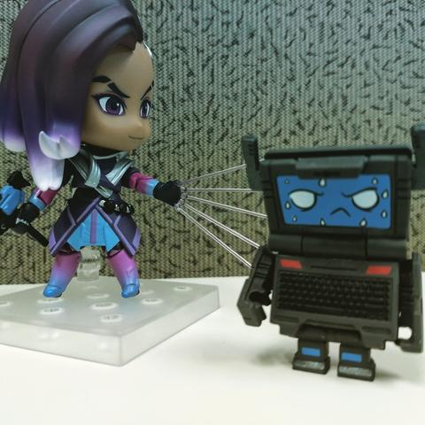 Nendoroid Sombra from Overwatch hacking a Transformers BotBots Laptop