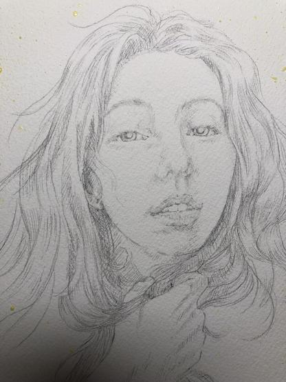Pencil, drawing of a young woman’s face. Her hand is clutched underneath her chin, holding a clump of her long hair. She has a wistful expression on her face. This drawing is a guide for a watercolour painting, it is not meant to be a final artwork.