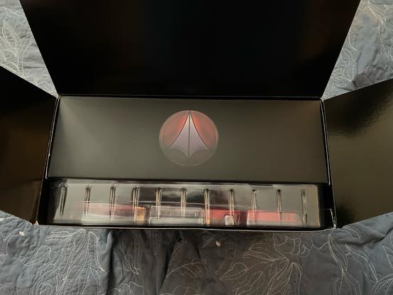VF-1S God of Flame open box showing the Macross logo