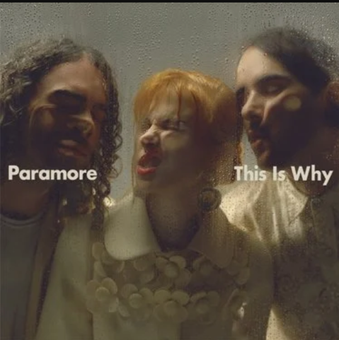 Paramore squishes themselves against some glass on the cover of This Is Why.