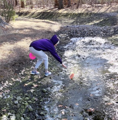 My wife retrieving her disc from a frozen puddle