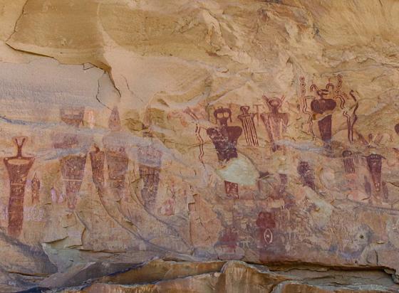 Strange looking figures painted red on a rock wall in Utah. Over 1,000 years old.