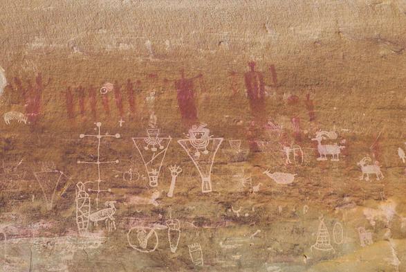Strange figures and symbols on a rock wall in Utah.