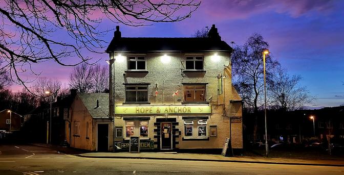 Pub with sunset in background.