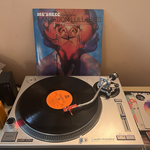 LP on turntable with sleeve in background. Promo version with cover art. Images of artist partial profile.
