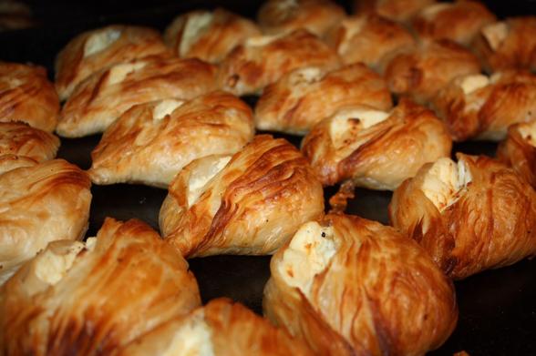 Perfectly cooked filo pastry authentic pastizzi. Crispy golden brown pastry with a ricotta filling peeking out at the top.