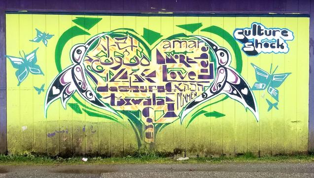 Culture Shock Namgis Nation Indigenous art mural on side of their native owned small business building in Alert Bay.