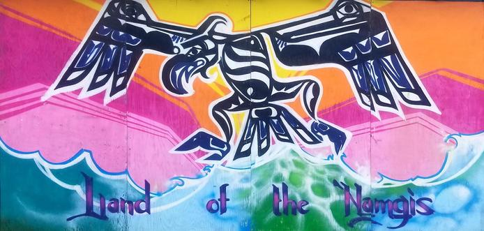 Land of the Namgis art mural.  Cormorant  Indigenous art is centered.