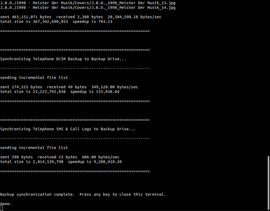 A screenshot of a bash terminal shows an rsync-based script that synchronizes files between a few different locations.  The example script shows J.B.O.'s album "Meister der Musik" being copied to a backup drive.  At the end of the output, the message "Backup synchronization complete.  Press any key to close this terminal.  Awoo."  is shown.