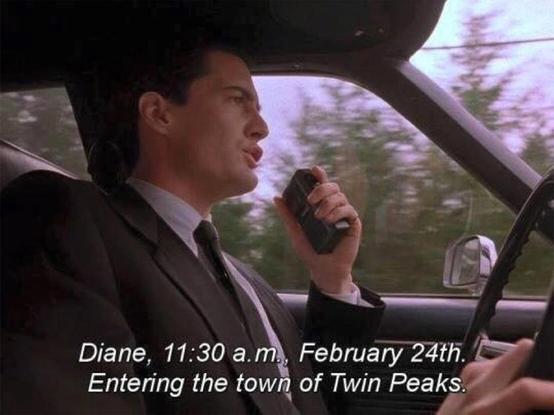 Agent Cooper from Twin Peaks in a car with the dialogue "Diane, 11:30 a.m., February 24th. Entering the town of Twin Peaks."