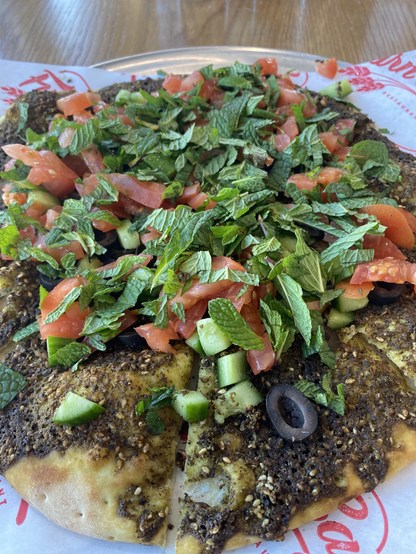 Saj zaatar with tomato mint and olives
