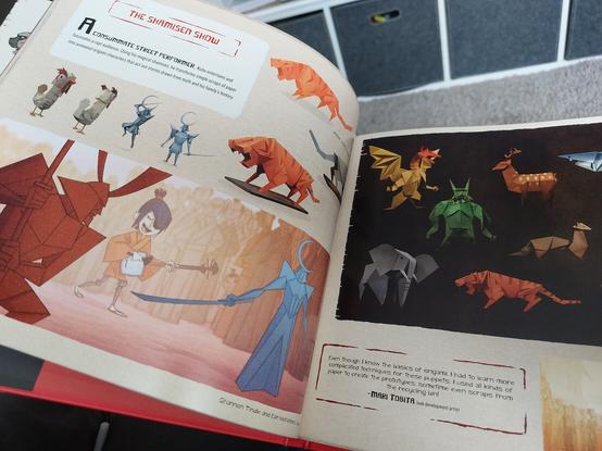 A page from the concept art book showing some of the origami character designs