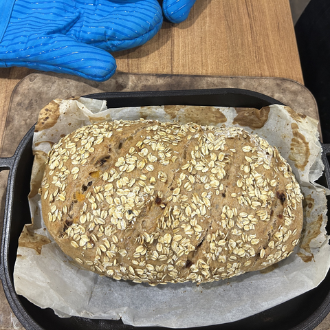 Closeup of the bread halfway through; it's risen but still pale of colour.