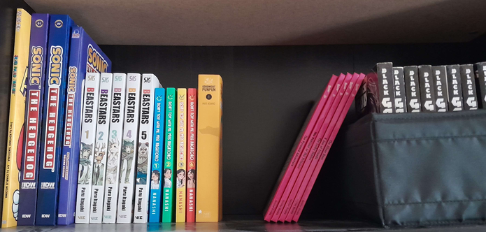 Part of my manga/comic collection. This shelf is a work in progress since my collections aren't complete as of yet, and shelf space is growing sparse. On this shelf, we have: The Super Mario Comic, IDW Sonic the Hedgehog (the deluxe editions, 1 and 2), IDW Sonic the Hedgehog 30th Anniversary Special, Beastars volumes 1-5, Don't Toy with Me Miss Nagatoro volumes 1-4, Goodnight Punpun volume 1, some Barbie Book Club books from my childhood, and off in that black box to the right, there's my growing Black God (Kurokami) manga collection. So far I have volumes 1-10, volume 12, and the rest are incredibly rare and hard to find... There are 19 volumes in total and I need volume 11, then 13-19.

I was blessed and cursed with a love for books, and cursed even more so with a love of rare or otherwise hard to find manga!