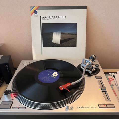 Wayne Shorter - The Soothsayer Lp on turntable with record sleeve in background.