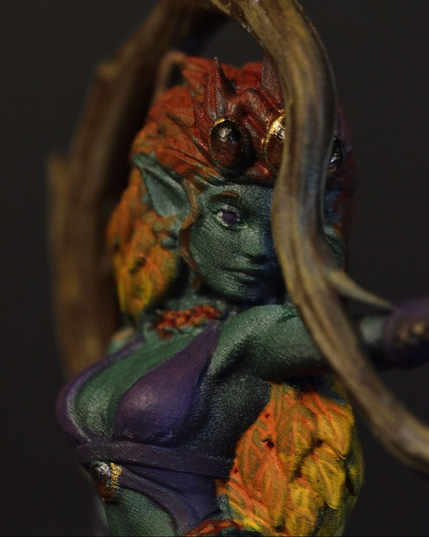 Dryad miniature with autumn leave hair, manipulating a vine.