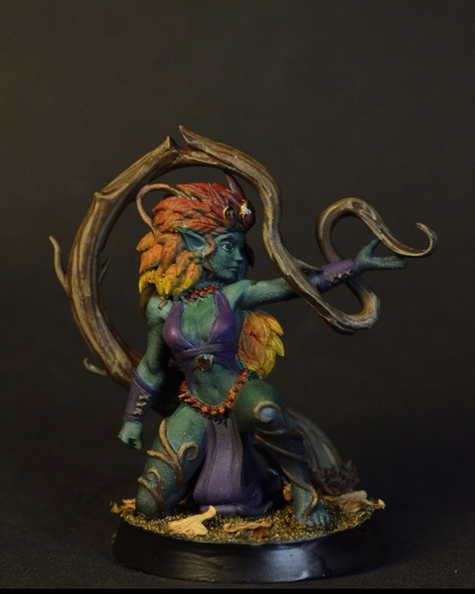 Dryad miniature with autumn leave hair, manipulating a vine.
