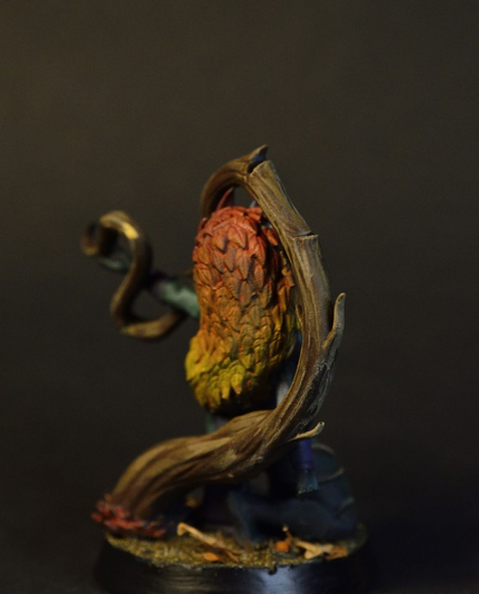 Dryad miniature with autumn leave hair, manipulating a vine.