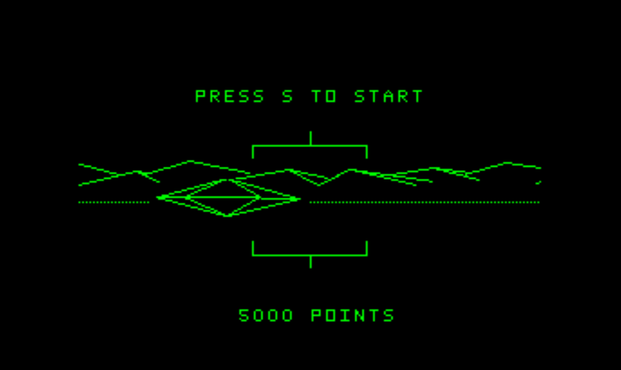 A screenshot of the ZX Spectrum version of BattleZone.
A wireframe UFO (it looks like a simple 3D diamond) is on-screen. Text reads "Press S to Start" and "5000 Points"..