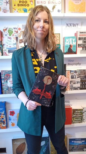 Author L R Lam with an advance copy of her forthcoming Dragonfall book, in the Edinburgh Bookshop