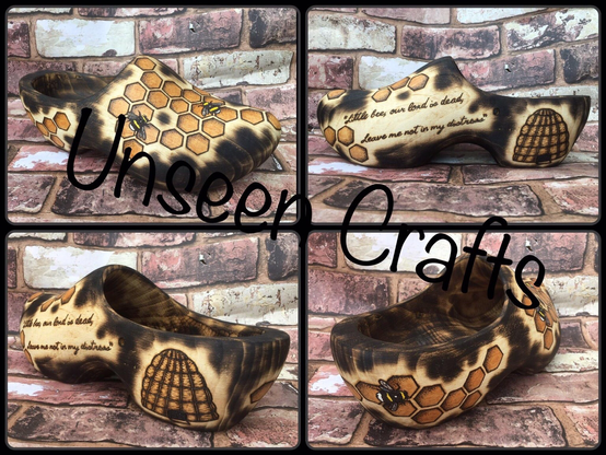 Large clog with hand burned design of honeycomb, bees and a hive.