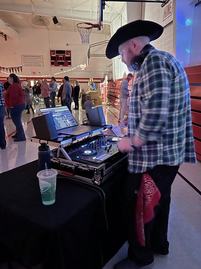 Beau Simensen dressed up and playing music for a barn dance-themed school family dance.