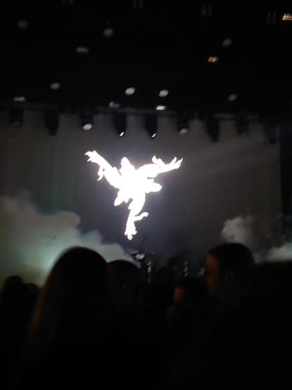 Amenra logo projected on backline of the stage