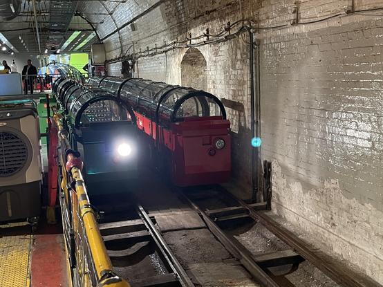 Two different mail trains are seen. One has a light on
