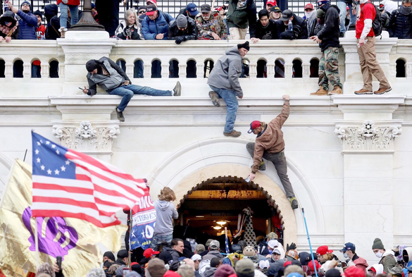 Photo: January 6 rioters attacking the U.S. Capitol Building.