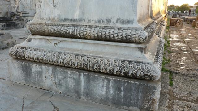 The banded decoration on the lower section of the temple walls, at the sanctuary of Apollo, Didyma. The upper of the two is a cylindrical sheath of laurel leaves; the lower a braided pattern comprising of two ribbons and circles.