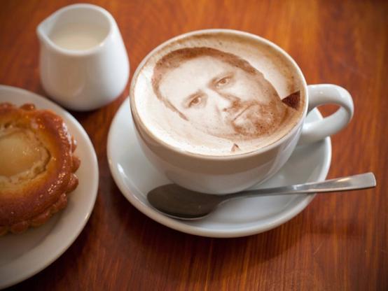 Cappuccino with my face in the sprinkles.