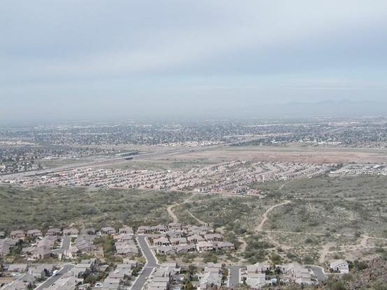 Overhead view of housing subdivisions and a freeway