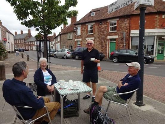 Walkers enjoying a coffee in the wonderful down of Nether Stowey after a long walk