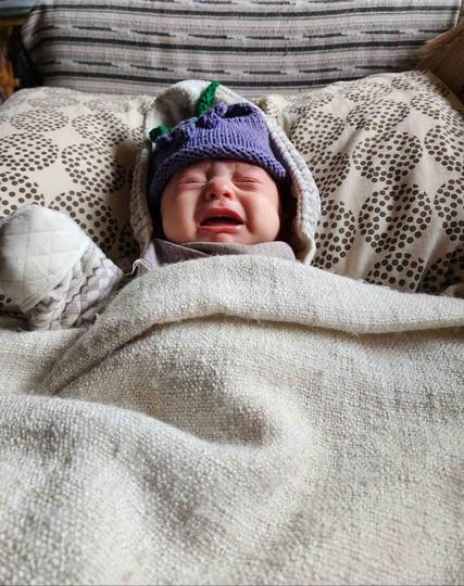 My baby nephew, crying because he needs a diaper change.