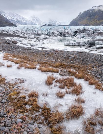 Portrait shot of the flooded moraine at the base of an Icelandic glacier
