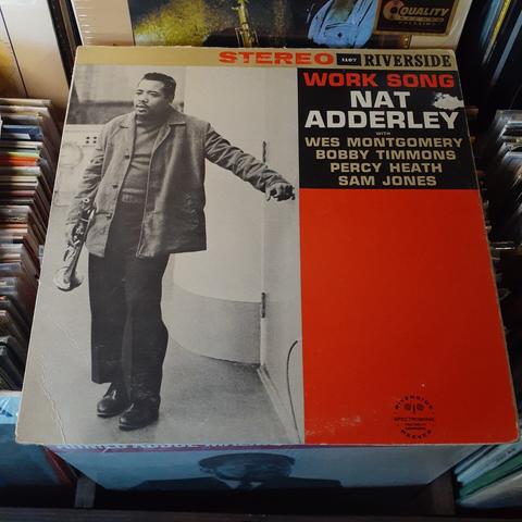Album cover features a black and white photo of the artist leaning against a wall, with a trumpet in his right hand.