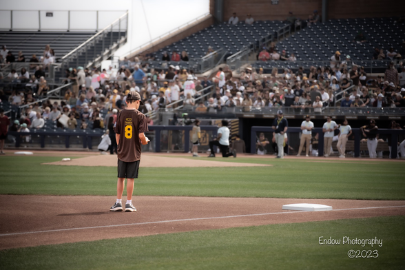Little leaguer and Manny Machado fan waits for his idol to take his position at third base before a Cactus League game versus the Oakland A’s