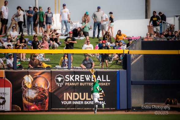 Oakland A’s right fielder Ramon Laureano tracks down a ball heading toward the fence, making an impressive backhanded catch